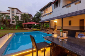 Sunshine Bloom by StayVista - Your Oasis with Pool, Lawn, Gazebo, and Poker Table